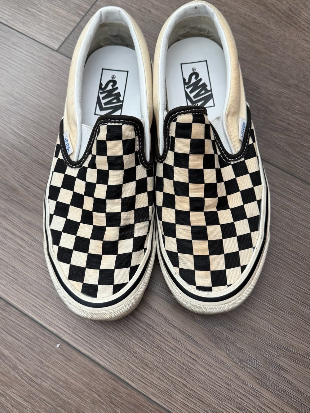 Vans Checkerboard Slip-On Sneakers in Black and Cream